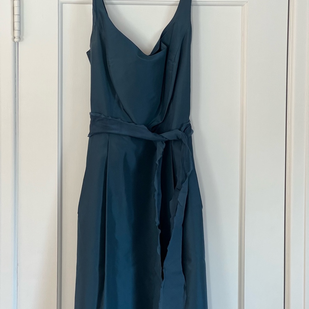 Worn as a bridesmaid’s dress this is a beautiful aquamarine dress.